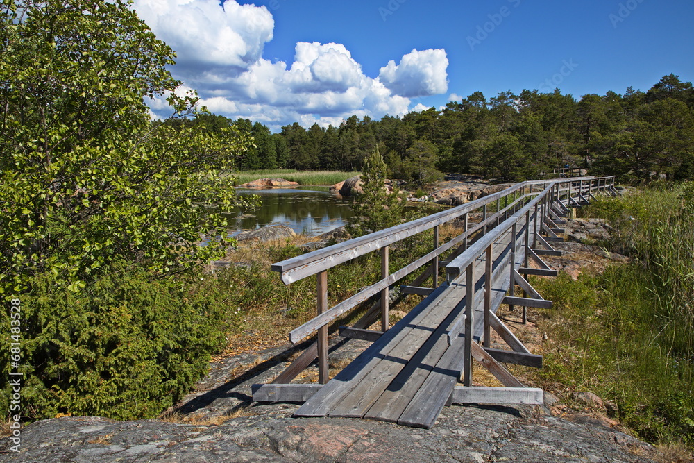 Wooden footbridge on hiking track on Stora Krokholmen in Stendörrens Naturreservat in Sweden, Europe
Wooden footbridge on hiking track on Stora Krokholmen in Stendörrens Naturreservat in Sweden, Europe