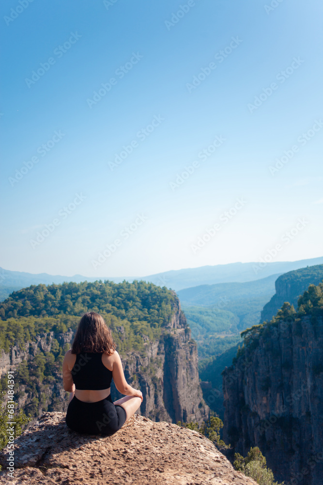Woman exploring Turkey's canyon, embracing the wonder of nature's majestic ravines