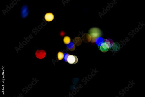 Colourful light bulbs spotlights on a dark background night decoration