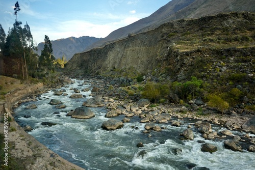 The Urubamba River in Peru in The Sacred Valley with The Andes Mountain range behind. 