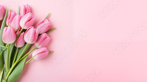 Pink tulips on pastel pink background, flatlay with copy space. Spring banner. International women's day, March 8, birthday, anniversary greeting card template photo