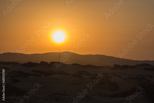 shining sun with mountains in the desert of egypt