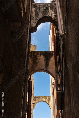 Narrow street of the old town of Marsala, Sicily, Italy photo
