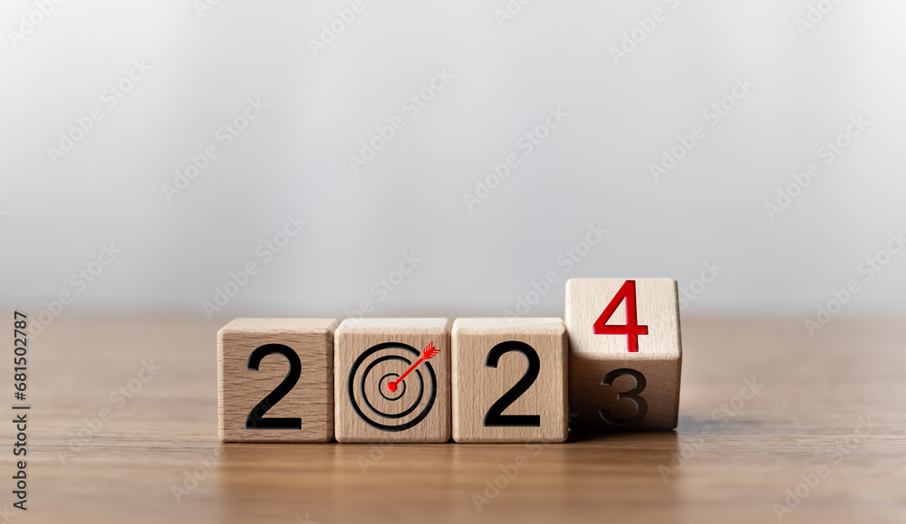 2024 Goals of business or life. Wooden cubes with 2024 and goal icon on smart background. Starting to new year. Business common goals for planning new project, Business target achievement.