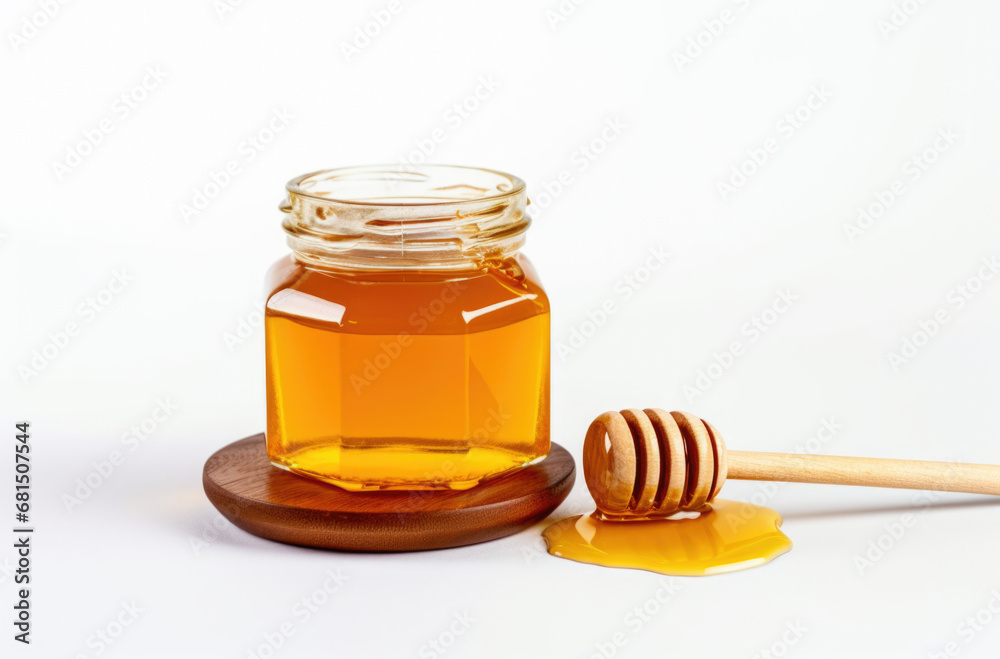 glass jar full of honey and dipper isolated on white background glass jar full of honey and dipper isolated on white background