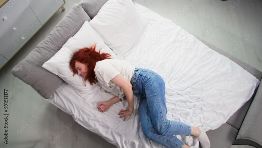 timelapse, young woman resting at home on bed in the bedroom, top view timelapse, young woman resting at home on bed in the bedroom, top view