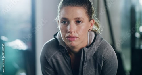 Break, gym and face of tired fitness woman breathing after training, exercise or intense cardio. Sports, fatigue or female athlete stop to breathe during workout, performance or weight loss challenge photo