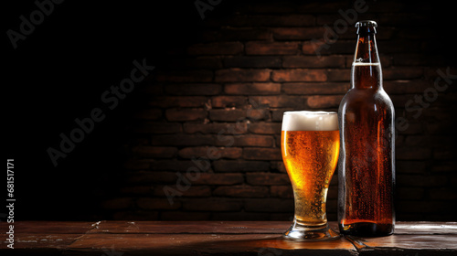 Bottle and glass of lager beer on dark background