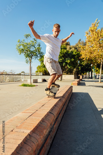 Carefree man jumping on skateboard while riding on street