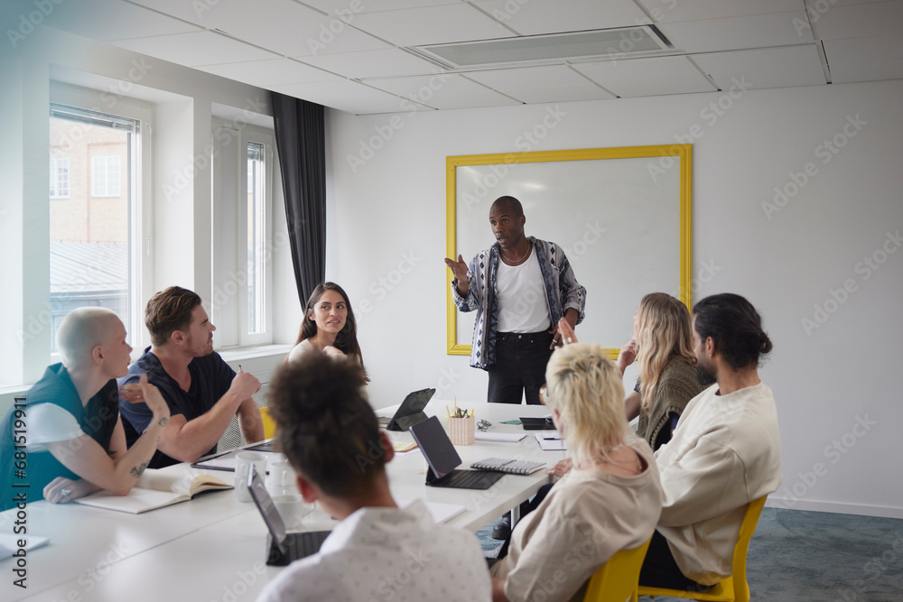 Diverse team having business meeting in conference room Diverse team having business meeting in conference room