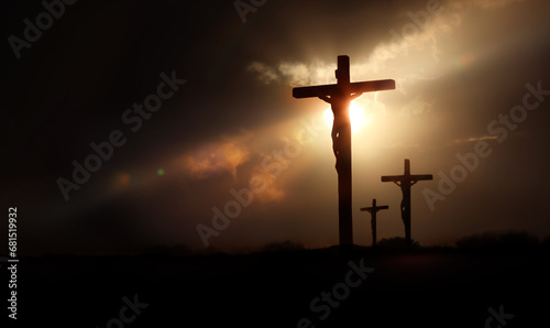 Dramatic light, sky and clouds background, passion of Jesus Christ on Golgotha hill and cross as symbol of Jesus' death and resurrection during Passion Week 