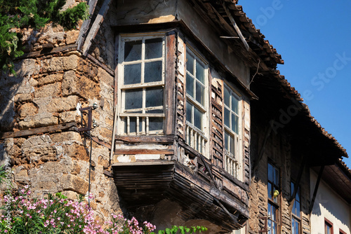 Old wooden windows in the one of the old ancient building of Kaleiсi. It is popular old historical quarter in Antalya. Turkey.