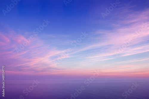 夕暮れ時の静寂な湖面：ピンク、青、オレンジのグラデーションが広がる空と、その色彩が完全に反映される穏やかな水面、そして広大な空とその反射だけが存在する無限の静けさ © sky studio