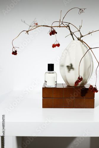 Composition of perfumes with a porcelain vase
