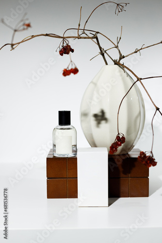 Perfume in a chipped bottle and packaging on a chest