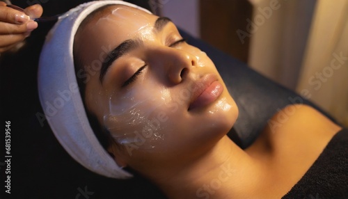 Young woman during face peeling procedure in salon 