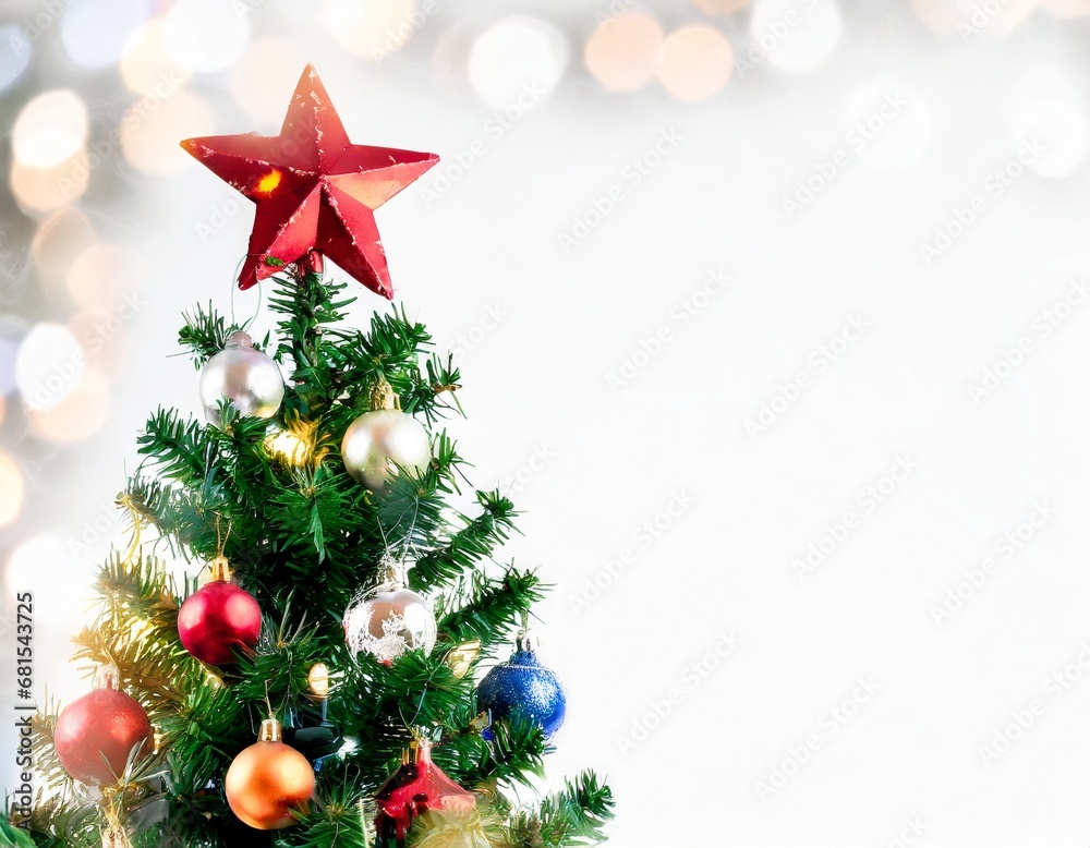 Isolated top of Christmas tree with ornaments, an bright star on top the spurce tree, with empty area for copy space