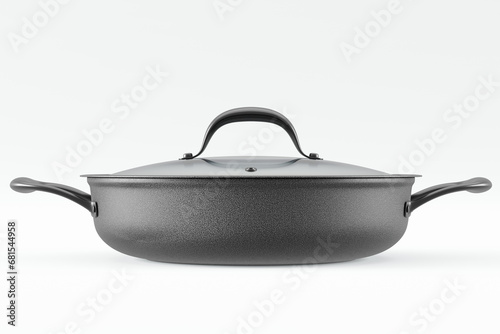 Stainless steel frying pan with glass lid and chrome cookware on white photo