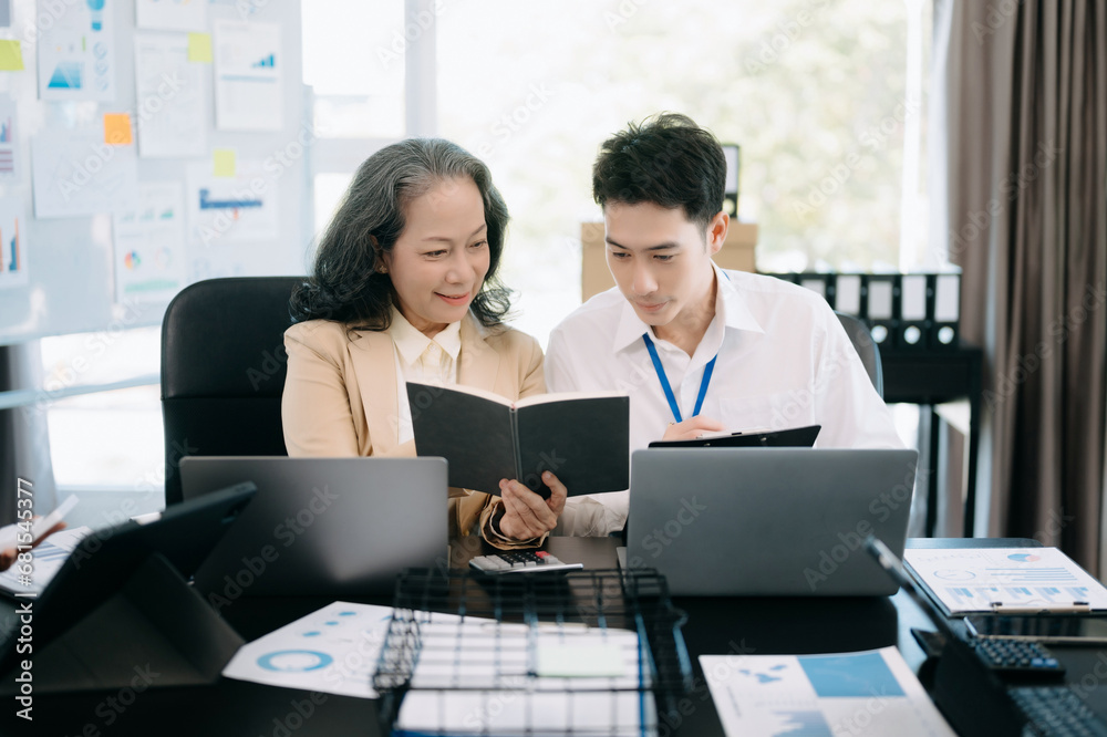 Kind leader executive manager share and discuss business solutions plan ideas on tablet in office Kind leader executive manager share and discuss business solutions plan ideas on tablet in office