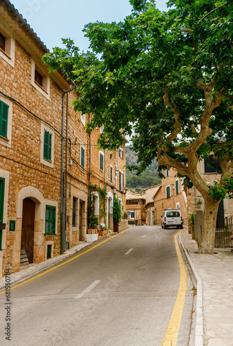 Empty road and old buildings in the charming small village Fornalutx