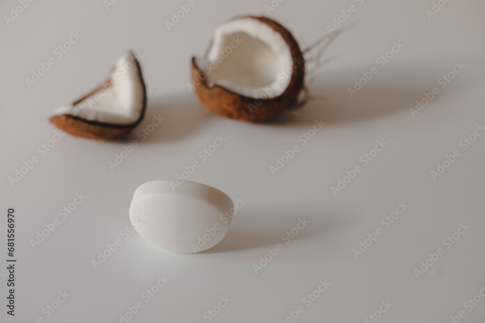 Natural herbal soap with coconut oil. Handmade soap bar and coconut on white background Natural herbal soap with coconut oil. Handmade soap bar and coconut on white background