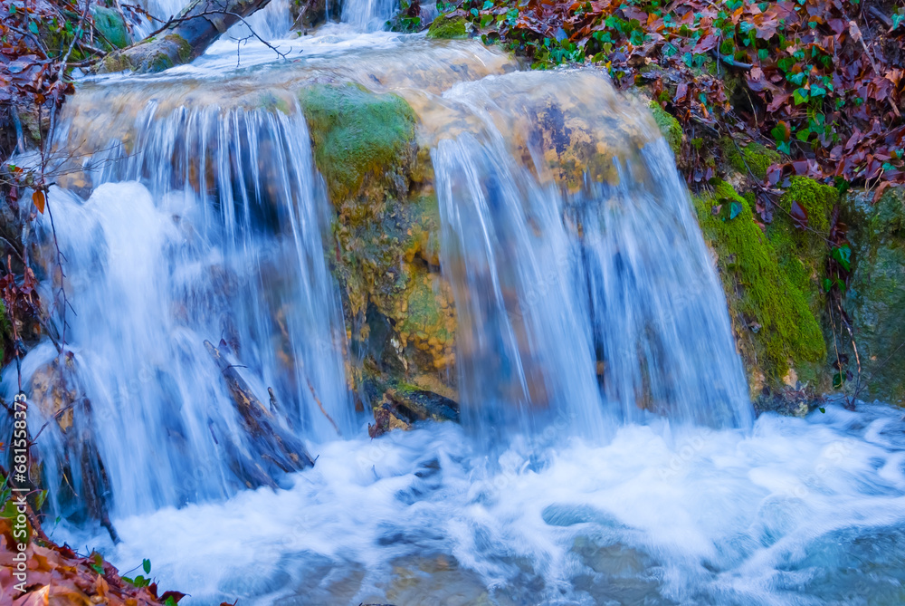 Obraz premium beautiful waterfall on mountain river, autumn mountain river scene