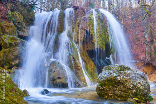 beautiful waterfall on mountain river  autumn mountain river scene