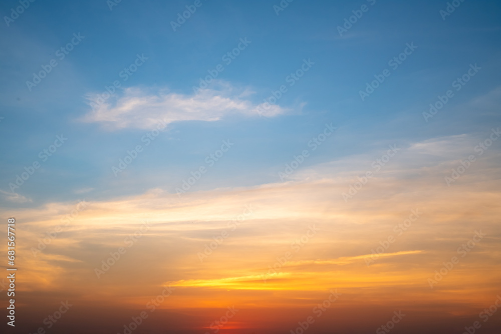 Beautiful of luxury soft gradient orange gold clouds and sunlight on the blue sky perfect for the background, take in everning,Twilight