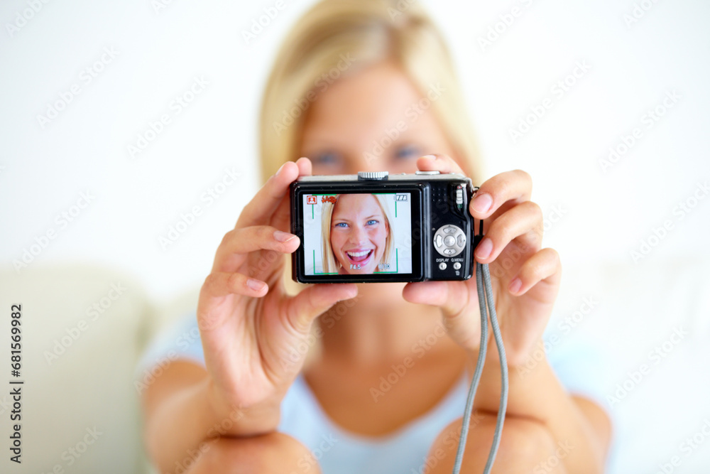 Portrait, smile and woman with a digital camera, happiness and memory with break, excited or cheerful. Face, person or girl with equipment, photography or joyful with peace, screen or home with frame