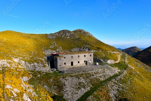 Old barrack of the Alpine wall at Mozic mountain above Soriska planina in Gorenjska, Slovenia photo