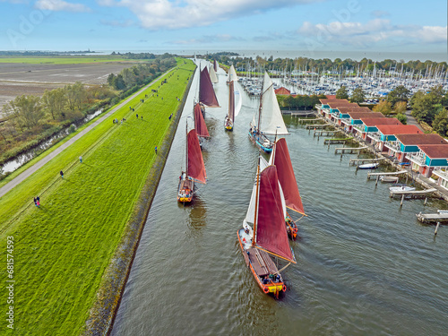 Aerial from a sailing competition the Workumer Strontrace with traditional sailing boats at Workum in the Netherlands photo