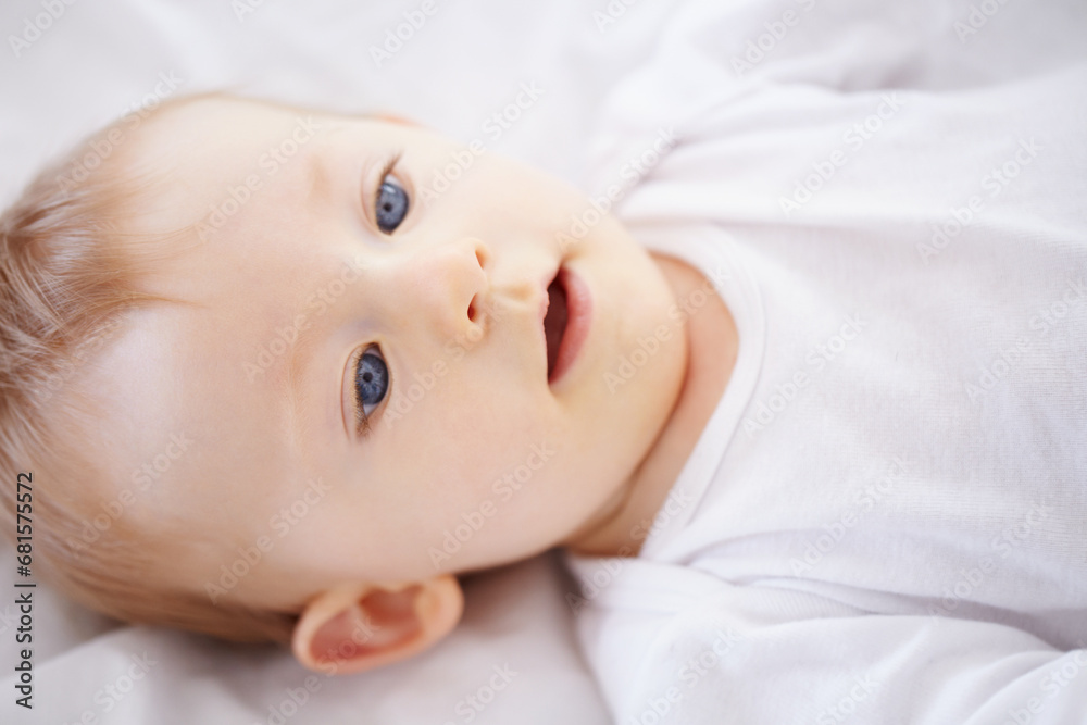 Home, bed and face of baby relax, resting and calm in nursery for sleeping or wake up in morning. Family, youth and closeup of infant newborn in bedroom for child development, growth and wellness Home, bed and face of baby relax, resting and calm in nursery for sleeping or wake up in morning. Family, youth and closeup of infant newborn in bedroom for child development, growth and wellness