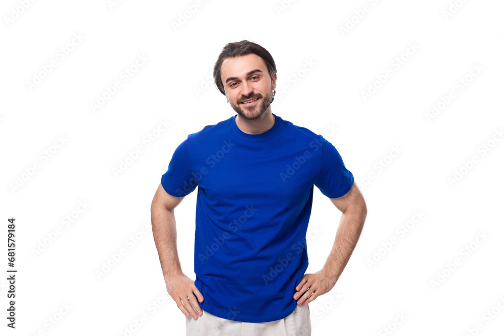 portrait of a young stylish caucasian brunette man with a beard in a blue t-shirt portrait of a young stylish caucasian brunette man with a beard in a blue t-shirt