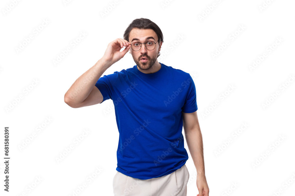 young smart european brunette man with beard thinks about strategy on background with copy space. brainstorm young smart european brunette man with beard thinks about strategy on background with copy space. brainstorm