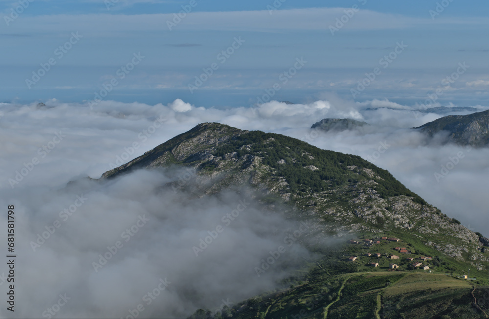 Village in the mountains over sea of clouds