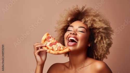 Studio portrait captures the delight of a cheerful afro woman eating pizza.