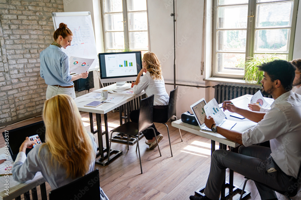 Business people meeting at office analyzing data, discussing for planning strategy for new project Business people meeting at office analyzing data, discussing for planning strategy for new project