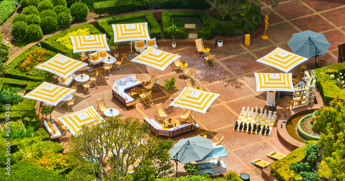 Perfect getaway vacation with yellow and whit themed resort courtyard aerial on sunny summer day, CA photo