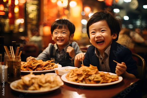 Chinese young Chinese boy laugh and diner with his friend  wearing cheongsam