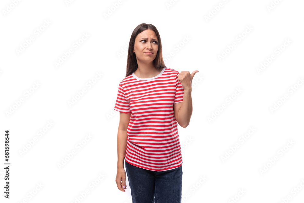 young european woman with straight black hair wears a striped red t-shirt on a white background young european woman with straight black hair wears a striped red t-shirt on a white background