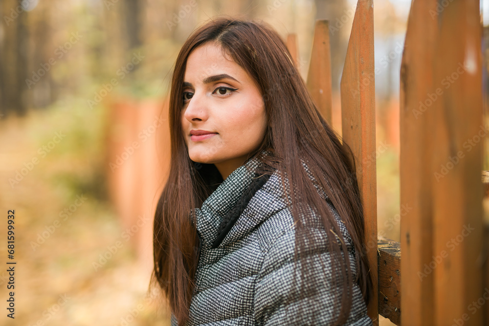 Close up portrait of pretty indian young woman enjoying warm autumn sunny day vacation outdoor copy space mockup. Generation z and gen z concept. Fall Season Close up portrait of pretty indian young woman enjoying warm autumn sunny day vacation outdoor copy space mockup. Generation z and gen z concept. Fall Season