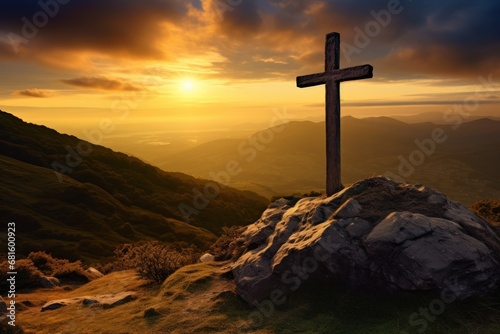  a cross sitting on top of a large rock in the middle of a grassy field next to a mountain under a cloudy sky with a sun setting in the distance.
