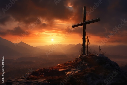  a cross on top of a hill with a sunset in the backgroup of the mountain in the backgroup of the picture is a cloudy sky.