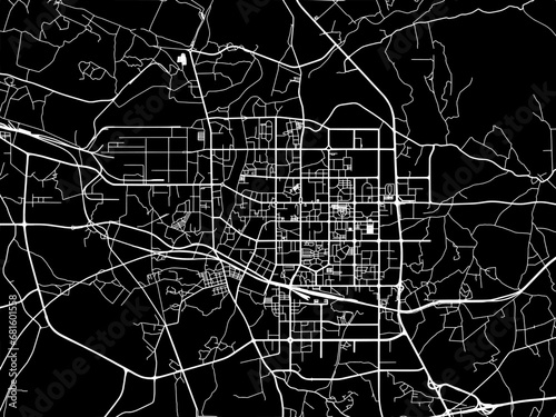 Vector road map of the city of Maoming in People's Republic of China (PRC) with white roads on a black background. photo