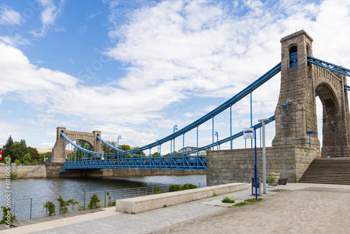 Blue Grunwaldzki Bridge crossing river Oder in Wroclaw historical capital of Silesia in Poland