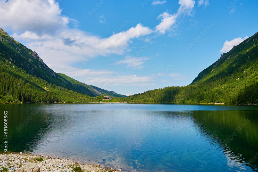 Mountains range near lake at summer day