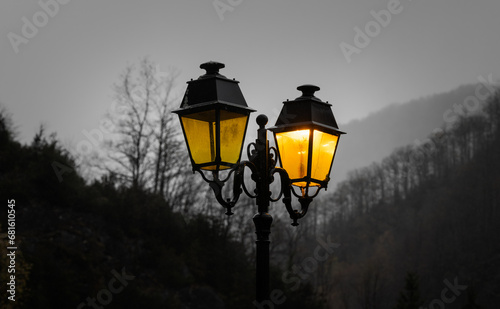 Street lanterns in the mountain village at dawn. Selective focus.
