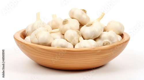 Garlic bunches in a bowl, isolated on a white background