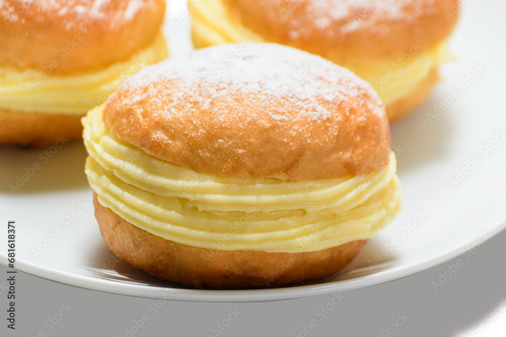 three bakery dreams on a white plate against three bakery dreams on a white plate against