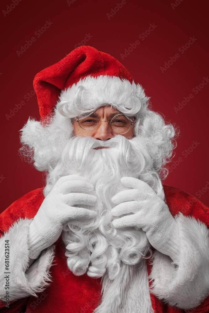 Shocked Santa Claus with a hand on head, surprised by holiday mischief Shocked Santa Claus with a hand on head, surprised by holiday mischief